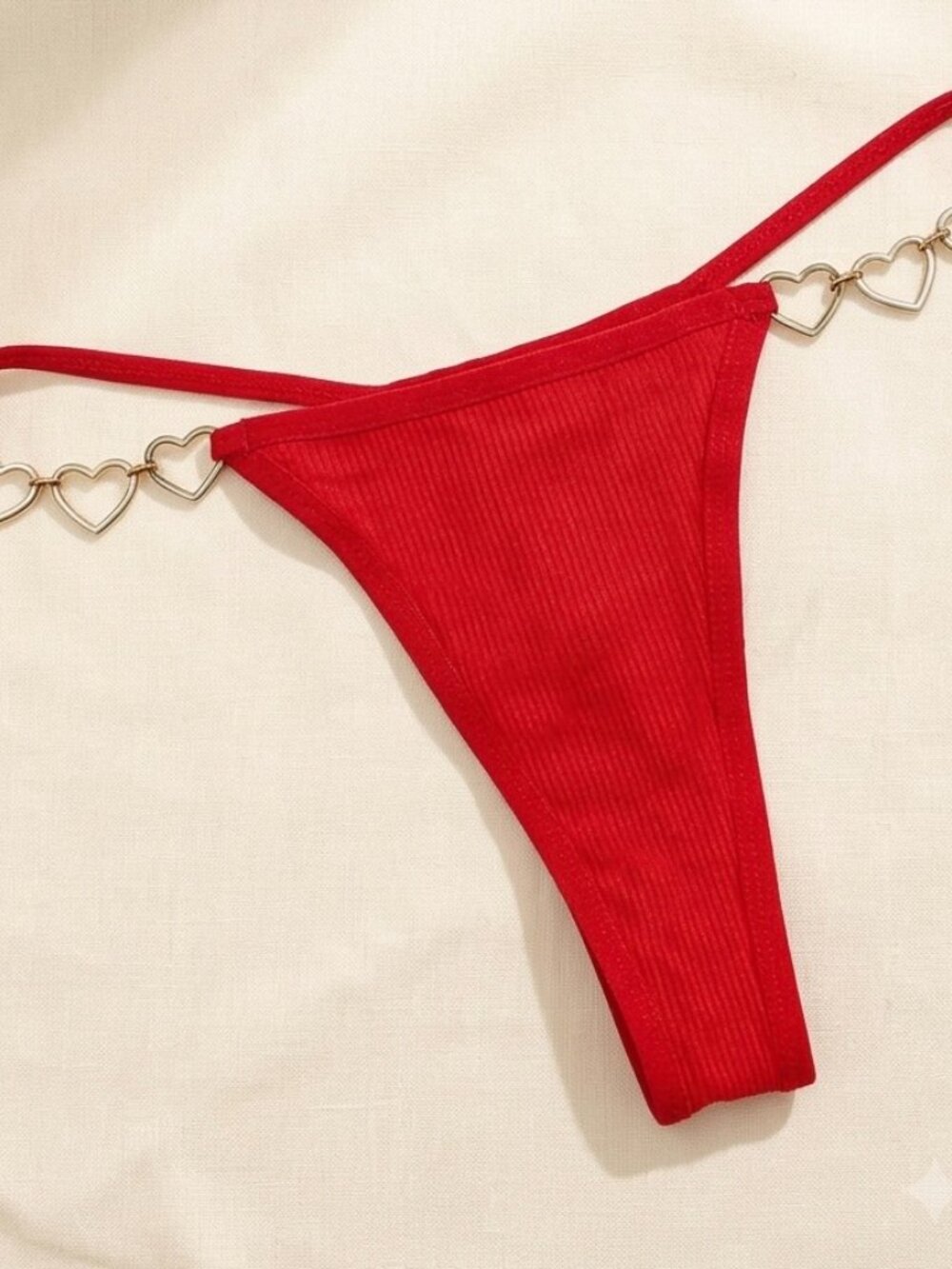 Sexy, stylish and vibrant metal heart decorated thong, size L